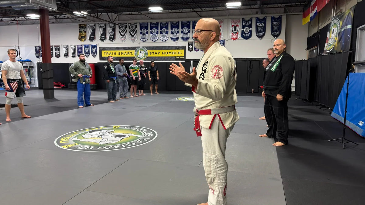 Carlos Machado teaching on the mats at his academy